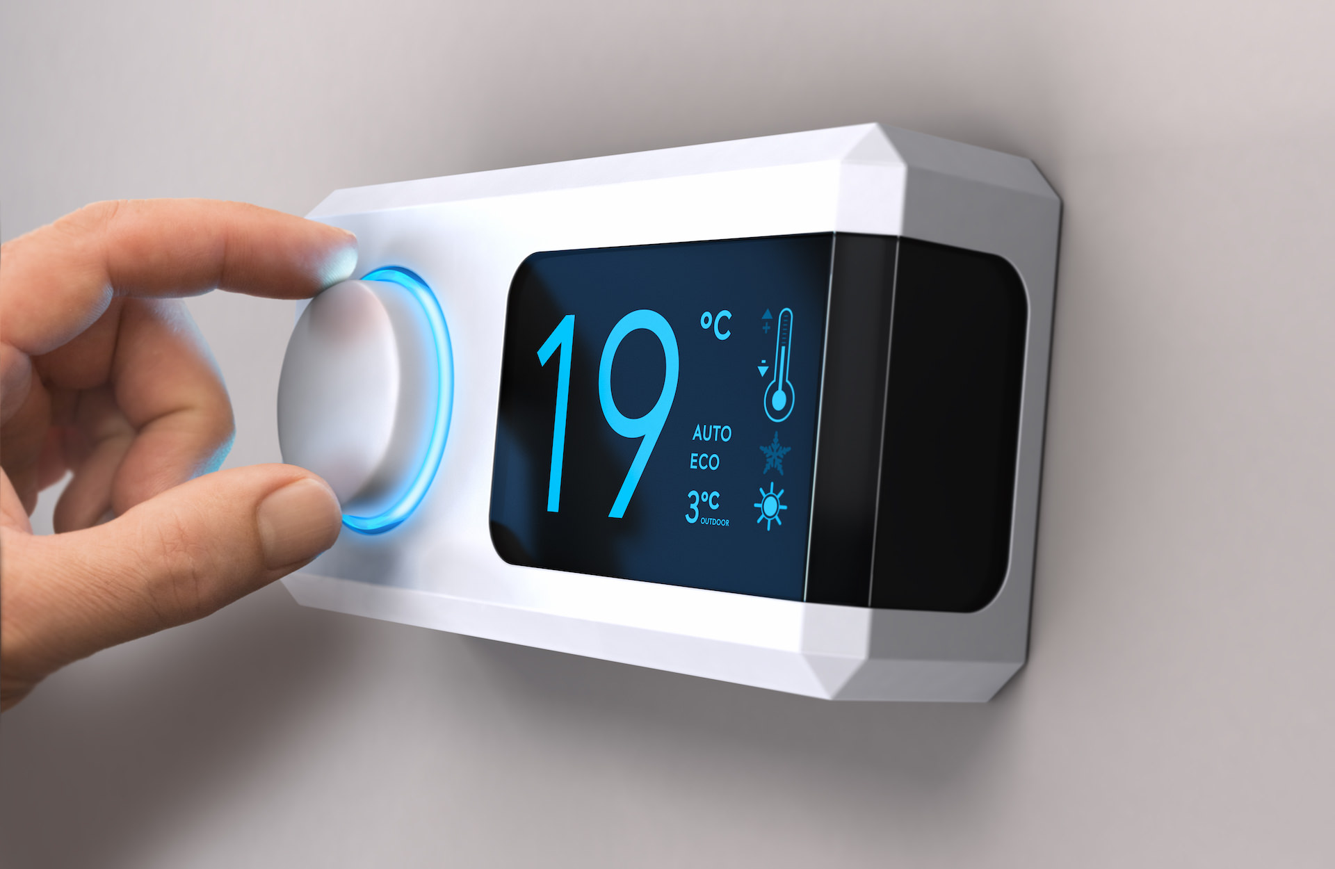 Hand turning a home thermostat knob to set temperature on energy saving mode. celcius units. Composite image between a photography and a 3D background.